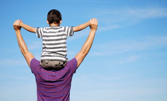 dad with boy on shoulders